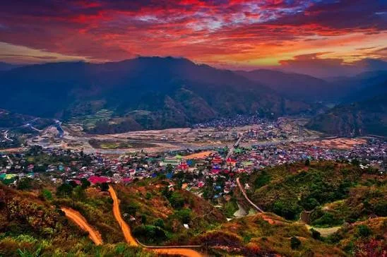 Bontoc valley and town beneath a dramatic red sunset