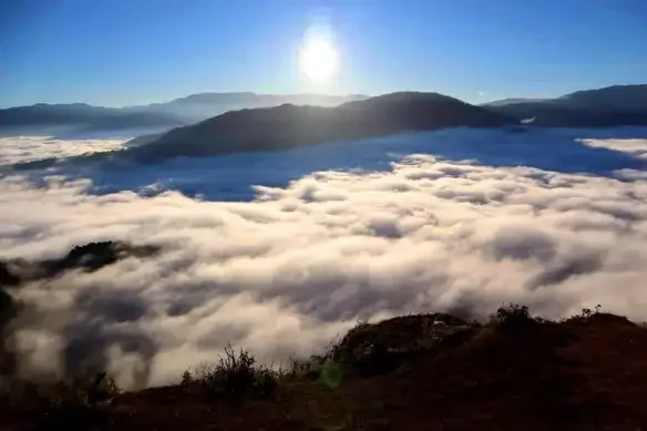 Sun rising above a sea of clouds in Sagada